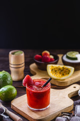 Brazilian caipirinha, Brazilian cocktail made with strawberry, cachaça and sugar. Ingredients of caipirinha, sugar, fresh strawberries and cachaça or vodka. Summer drink, served cold in Brazil.