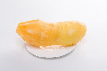 Smallanthus sonchifolius on the white plate, he in the white background, is a nutritional health of the wild plant fruit, pharyngeal inhibition