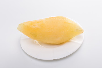 Smallanthus sonchifolius on the white plate, he in the white background, is a nutritional health of the wild plant fruit, pharyngeal inhibition