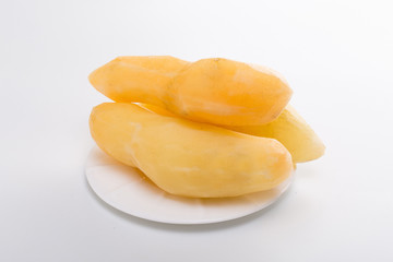Smallanthus sonchifolius on the white plate, he in the white background, is a nutritional health of the wild plant fruit, pharyngeal inhibition