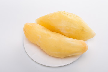 Smallanthus sonchifolius on the white plate, he in the white background, is a nutritional health of the wild plant fruit, pharyngeal inhibition