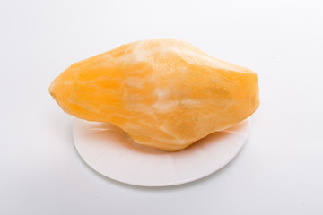 Smallanthus sonchifolius on the white plate, he in the white background, is a nutritional health of the wild plant fruit, pharyngeal inhibition