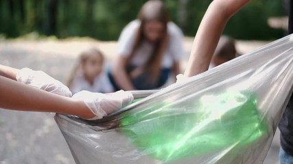 It is a garbage bag. Volunteers pick up the litter. They clean the forest.