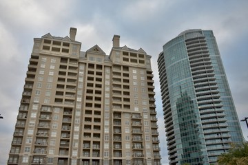 Fototapeta na wymiar Two high rise condominium towers with an overcast sky