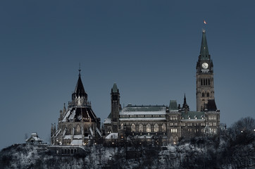 Center Block and library of Parliament Hill in Ottawa at dusk in winter
