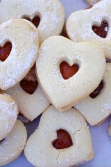 A heart shaped sugar sandwich cookie with berry jam for Valentine's Day