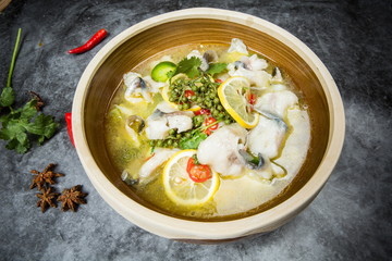 This is a famous dish in chengdu, sichuan province, China. It is called clear sweet sour and hot fish. It is mainly made of lemon, pepper, grass carp, green pepper and chicken soup