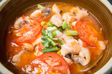 This is a famous dish in chengdu, sichuan province, China. It is called clear sweet sour and hot fish. It is mainly made of lemon, pepper, grass carp, green pepper and chicken soup