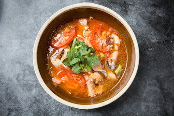 This is a famous dish in chengdu, sichuan province, China. It is called clear sweet sour and hot fish. It is mainly made of lemon, pepper, grass carp, green pepper and chicken soup