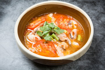 This is a famous dish in chengdu, sichuan province, China. It is called clear sweet sour and hot fish. It is mainly made of lemon, pepper, grass carp, green pepper and chicken soup