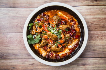 This is a famous hot pot dish in Chengdu, Sichuan Province, China. It's made of all kinds of meat and peppers. It's spicy but delicious