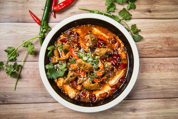 This is a famous hot pot dish in Chengdu, Sichuan Province, China. It's made of all kinds of meat and peppers. It's spicy but delicious