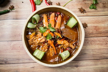 It is a popular food in Asia. It is made of cow's louver, sauce, pepper, cucumber, carrot, pig's blood and chicken feet. It is delicious and spicy