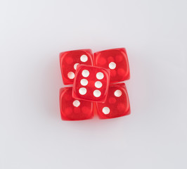 group of red playing dice on a white background, isolated. top view