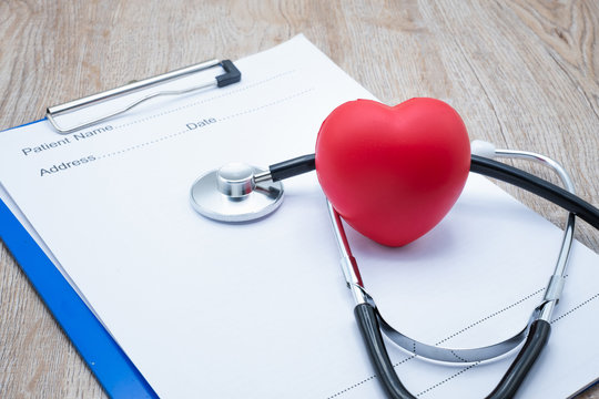 Red heart doctor stethoscope and doctor's prescription Health examination concept, health insurance Medical health Taking care of yourself as the doctor ordered.