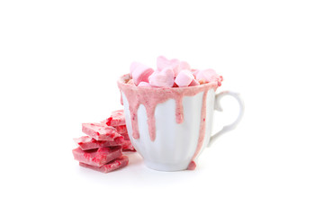 strawberry pink color hot chocolate with heart shaped marshmallows 