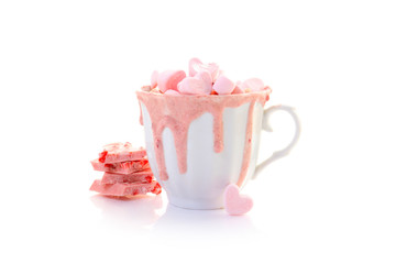 strawberry pink color hot chocolate with heart shaped marshmallows 