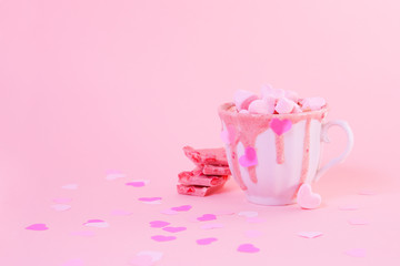 strawberry pink color hot chocolate with heart shaped marshmallows 