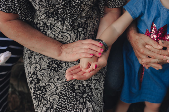 A Woman Aged With An Old Wrinkled Hand Holds The Hand Of A Little Girl, Without A Face. Photo About Generational Relations And Care For Old Age