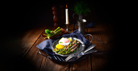 delicious green asparagus wrapped in bacon and egg