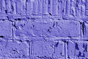 Old painted brick wall close-up. Brick wall background blue color toned