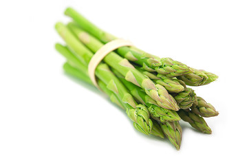Bunch of fresh organic green asparagus on white background