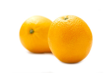 Two organic ripe fresh oranges isolated on white background