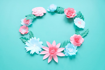 Hello, spring. With pink and blue paper flowers and green leaves
