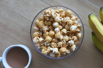 top view of popcorn and tea on table
