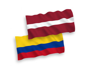 Flags of Latvia and Colombia on a white background