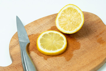 lemon cut with a knife on a Board