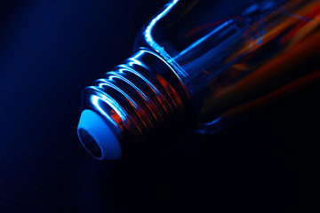 Light bulb on black background close up