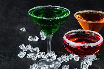 Beautiful alciohol cocktail on dark stone table
