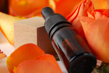 Cosmetics containers decorated with orange rose petals