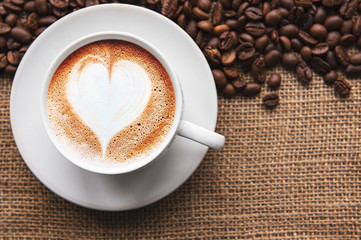 A cup of coffee with heart pattern