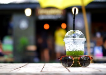 Mojito Cocktail - Homemade refreshing summer drink with sunglasses. Blurred for background abstract