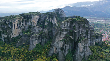 Naklejka premium Aerial view of Meteora natural mountains, Kalambaka, Greece. Unesco world heritage. Kalabaka National park with orthodox monasteries. Cliff valley.
