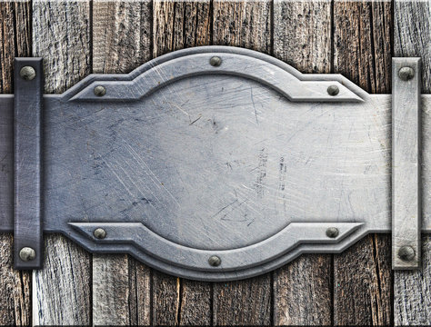 Metal  on old wooden background