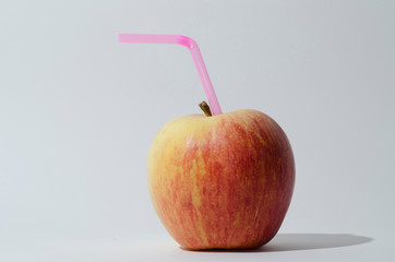 Apple Fruit with Plastic Straw.
