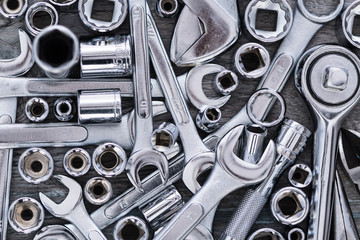 Hardware Tools, adjustable wrench, socket wrench, Sockets on wood background, top view, flat lay