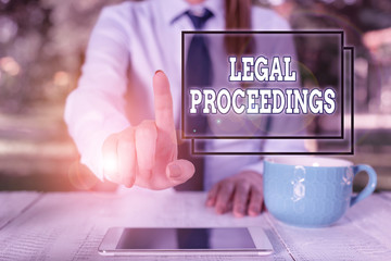 Writing note showing Legal Proceedings. Business concept for procedure instituted in a court of law...