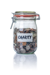 Isolated jar filled with coins labeled Charity