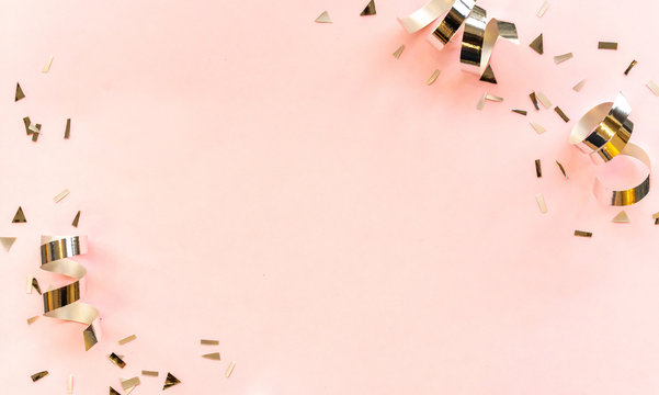close up on group of silver color of rolling ribbon and confetti on pink background with copy space for valentine's day ,carnival , birthday and anniversary, concept design