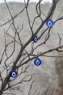 Nazar - A Traditional Blue Glass Amulet From The Evil Eye Attached To The Branches Of A Tree. It Is Also Called The Eye Of Fatima.
