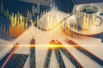 Double exposure of graph and financial info and work space with computer background. Concept of...