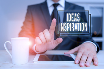 Text sign showing Ideas Inspiration. Business photo text feeling of enthusiasm you get from someone or something Male human wear formal clothes present presentation use hi tech smartphone