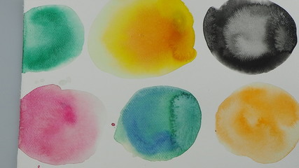 Watercolor hand painted circle shape design elements. Set of multicolored watercolor dots