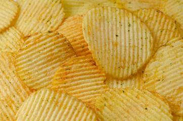 Background with appetizing potato chips
