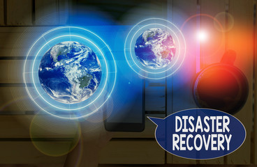 Text sign showing Disaster Recovery. Business photo showcasing helping showing affected by a serious damaging event Elements of this image furnished by NASA