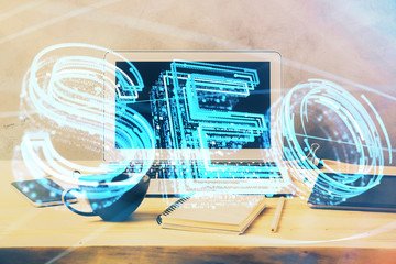 Multi exposure of table with computer and seo drawing hologram. Search optimization concept.